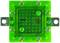Green LED light block with ten visible light-emitting diodes. The diodes are symmetrically arranged around a central square.
