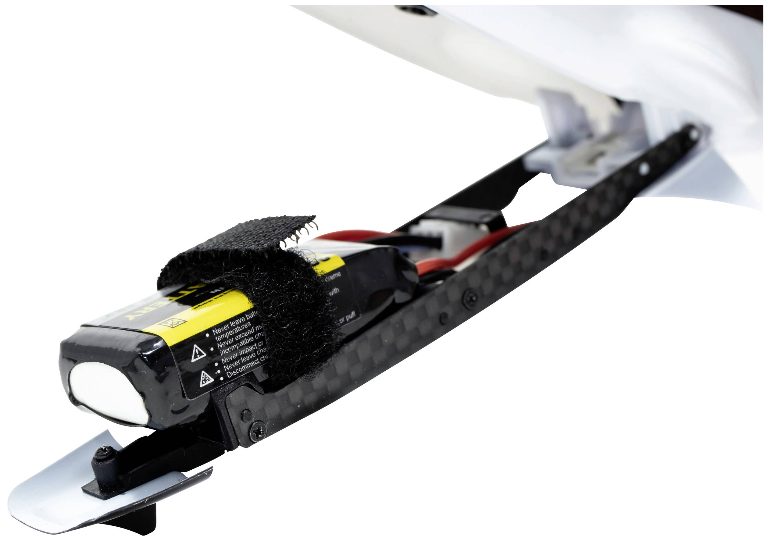 A battery pack is secured to a frame with a hook and loop fastener. This could be a component of a remote-controlled vehicle.