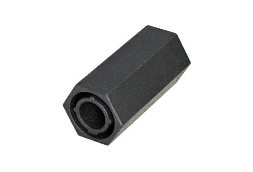 A black, hexagonal metal block with a cylindrical internal cavity.