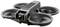 A compact, grey drone with four rotors and a camera on the front, suitable for aerial photography and videography.
