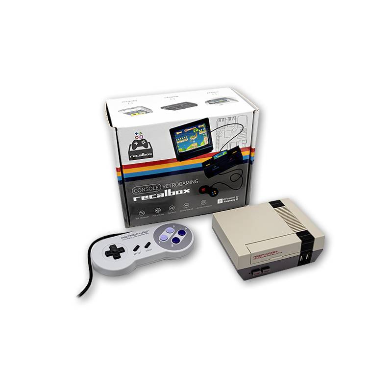 Compact retro console with a minimalist controller in front of packaging displaying designs and games.