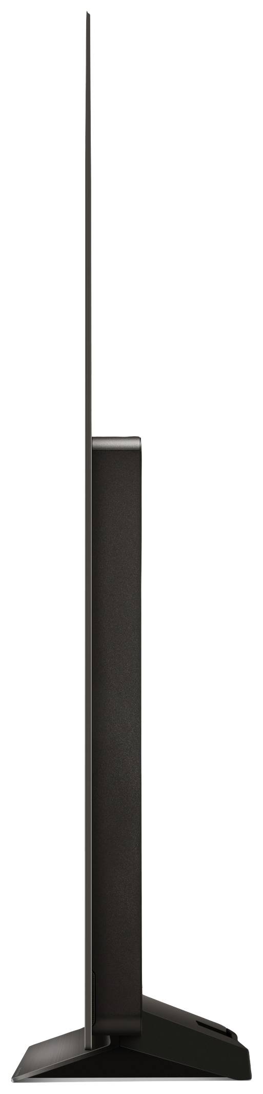 An ultra-thin television from the side, showcasing its sleek design and narrow stand.