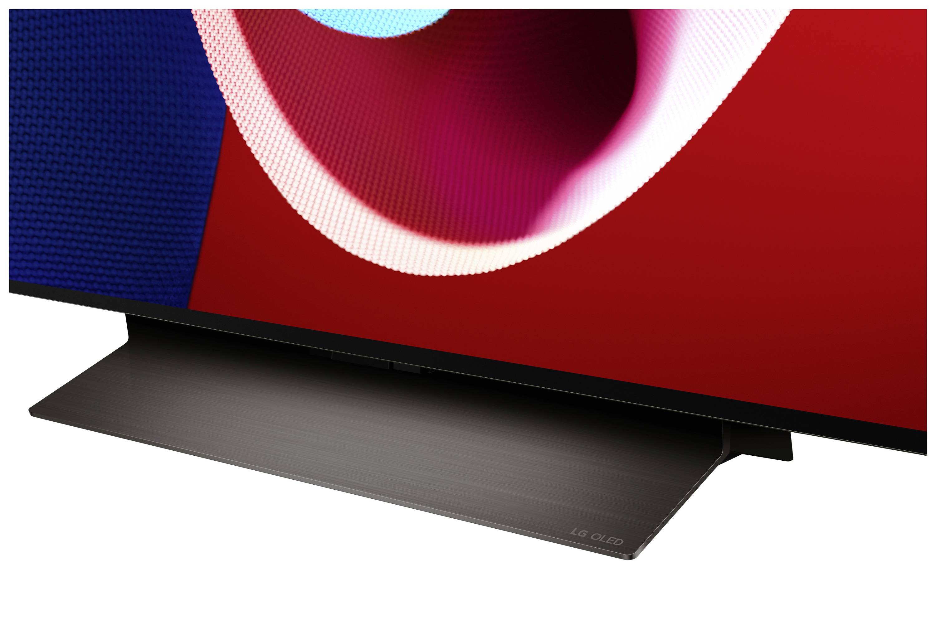 A television with a slim bezel and large screen displays a colourful, abstract art motif. Below is a rectangular stand.