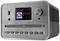 A silver radio with a screen displays 'Internet Radio Hitradio Ö3' and 'James Blunt – When I Find Love Again', with a CD slot underneath.