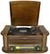 A vintage record player with an open lid plays a vinyl record. The design is wood-panelled, featuring a radio and CD player.