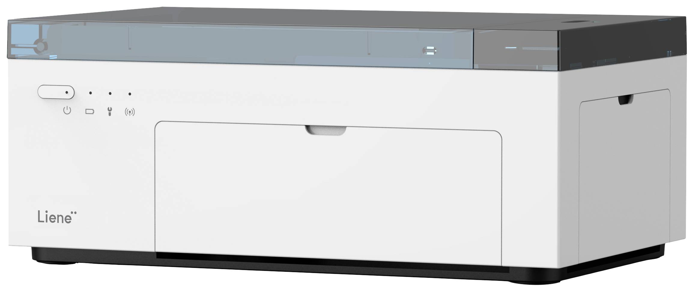 A white printer with a black lid on a table. Control buttons and a brand logo are visible on the front.