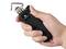 A hand is holding a black tool, presumably an electric knurling tool by the brand TOOLCRAFT, with a metal attachment.