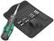 A screwdriver set on a black mat with interchangeable bits. The main screwdriver has a green handle.