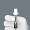 A white glove holds a document with a white arrow pointing downwards, indicating the induction process.