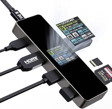 A black USB hub with multiple connected cables and two SD cards. A display shows information about the connections.