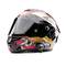 A motorcycle helmet with a black visor and a striking, colourful design, including a racetrack pattern on the side.