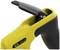 Close-up of a yellow cable stripping tool with a black handle and a blade for efficiently removing insulation.