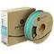 A spool of turquoise 3D printer filament and a packaging box from the Polymaker brand.