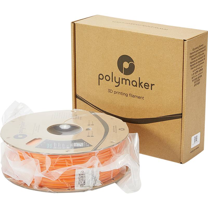 A roll of orange 3D printer filament from Polymaker next to a brown packaging box.