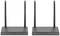 Two black 4K wireless HDMI KVM extenders, each with two aerials, are positioned side by side.