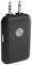 Black wireless audio transmitter with two 3.5mm jack plugs and a central button, used for wireless music streaming.