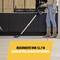 A woman hoovers the floor with a vacuum cleaner; text emphasises 'reach of 12.7 m thanks to extra-long power cable'.