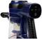 Blue cordless vacuum cleaner in close-up, showing power and filter control elements on the top of the handle.