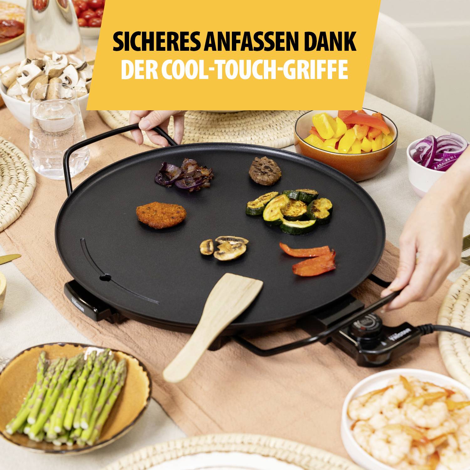 An electric griddle with foods such as vegetables, meatballs and prawns. Text at top: 'Safe handling thanks to cool-touch handles'.
