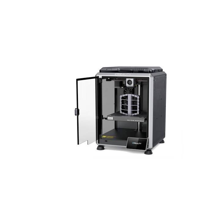 A 3D printer with an open door, showing the print area and an unfinished structure on the platform.