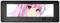 Anime figurine with pink hair and large eyes on a screen, framed by a black casing with the 'Thermaltake' logo.