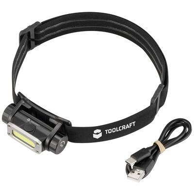 A black head torch with 'TOOLCRAFT' printed on it, alongside a USB charging cable. Ideal for hands-free use in the dark.
