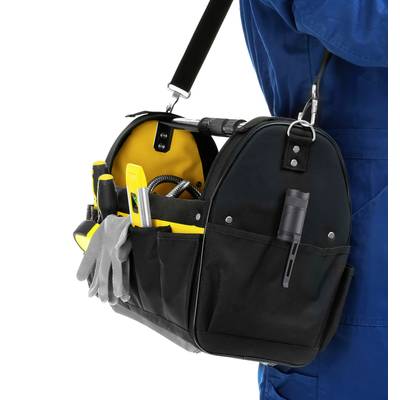 A black fabric tool bag, filled with various tools such as screwdrivers and pliers, is slung over the shoulder of a person wearing blue workwear.