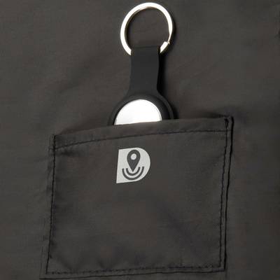 A black fabric item with a small pocket holding a key ring with a black charm. The pocket displays a stylised symbol.
