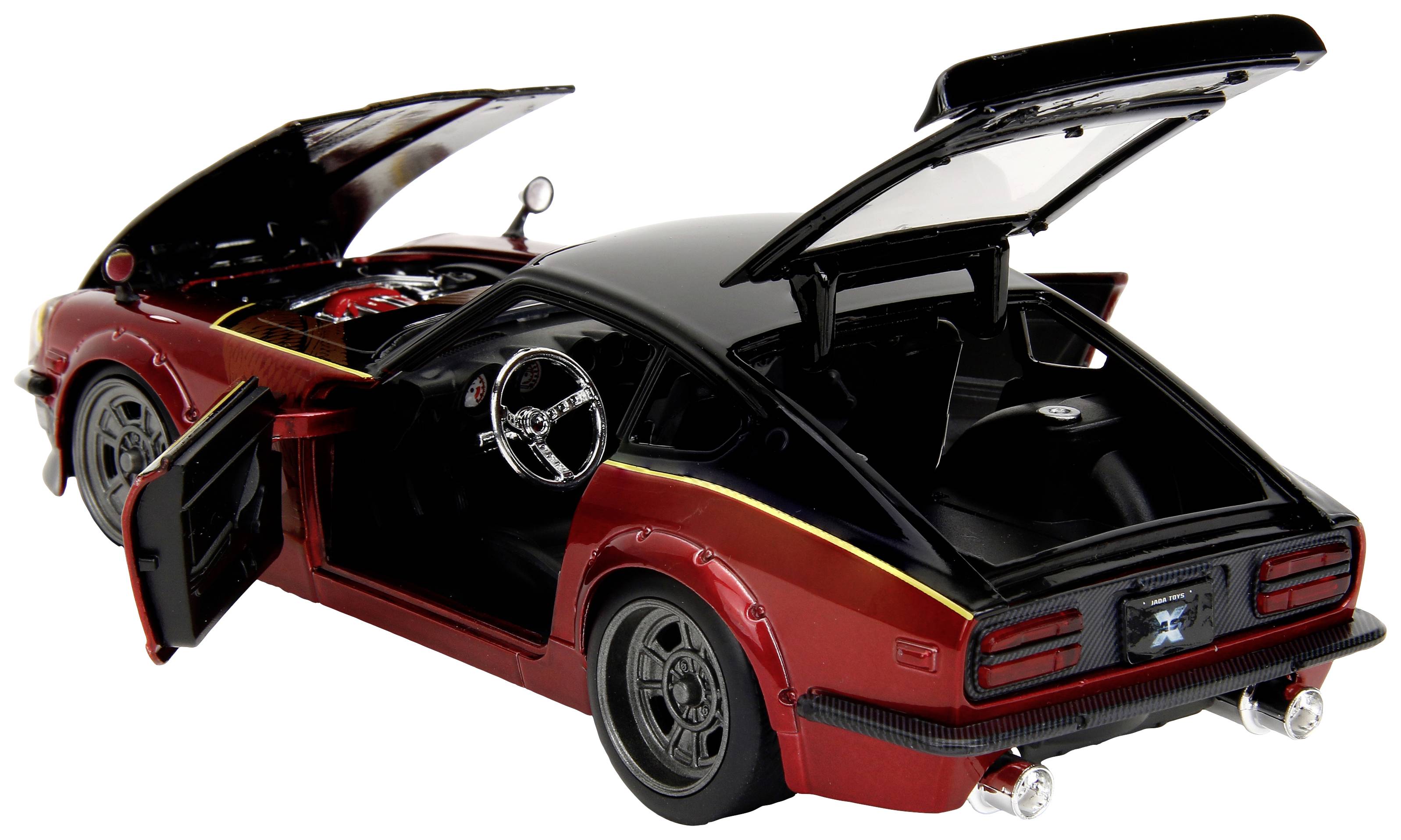 A red model car with open doors and bonnet reveals details of the interior and engine. It conveys the style of a classic sports car.