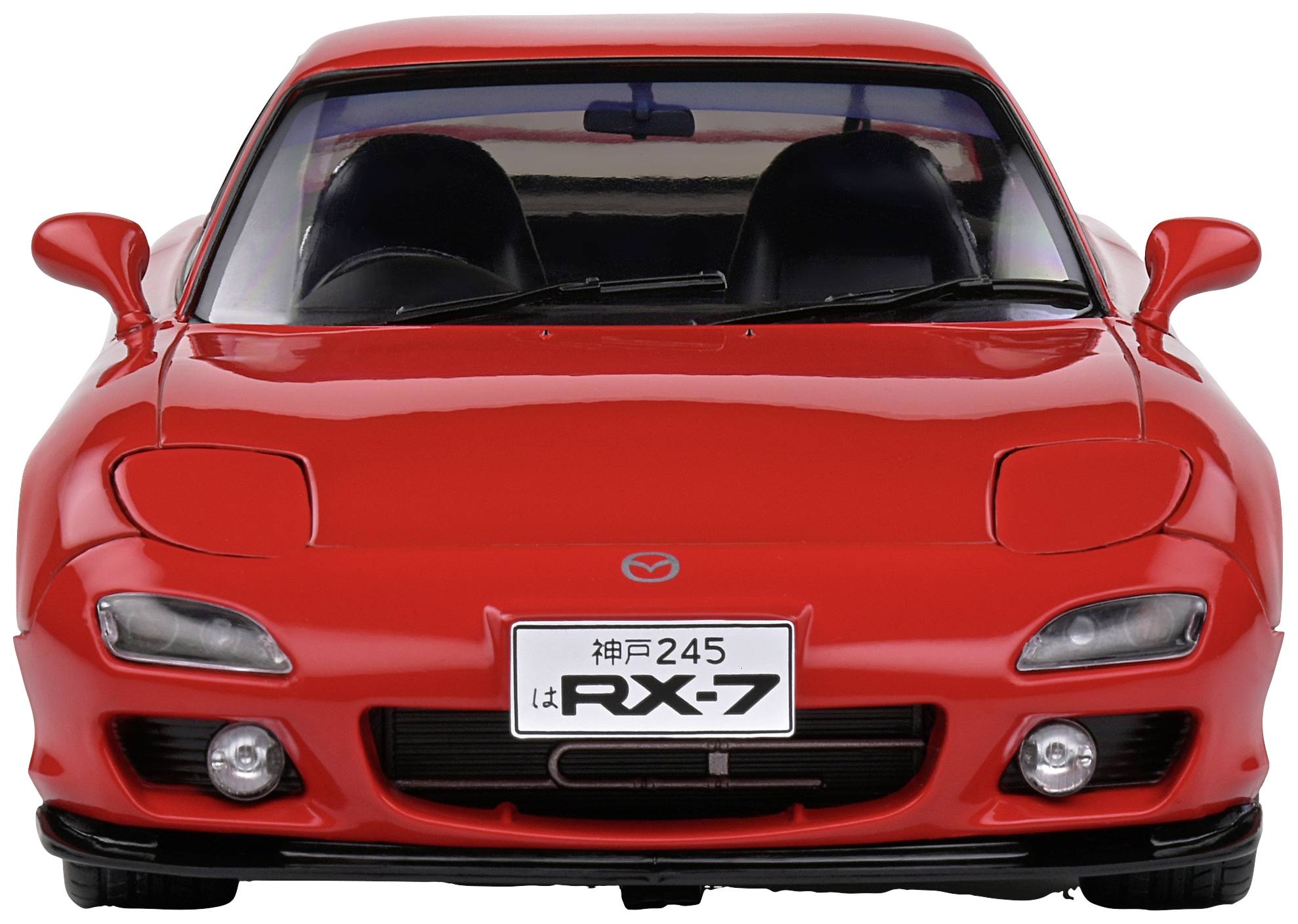 A red sports car from the front, RX-7 model, with round headlights and a number plate 'RX-7'.