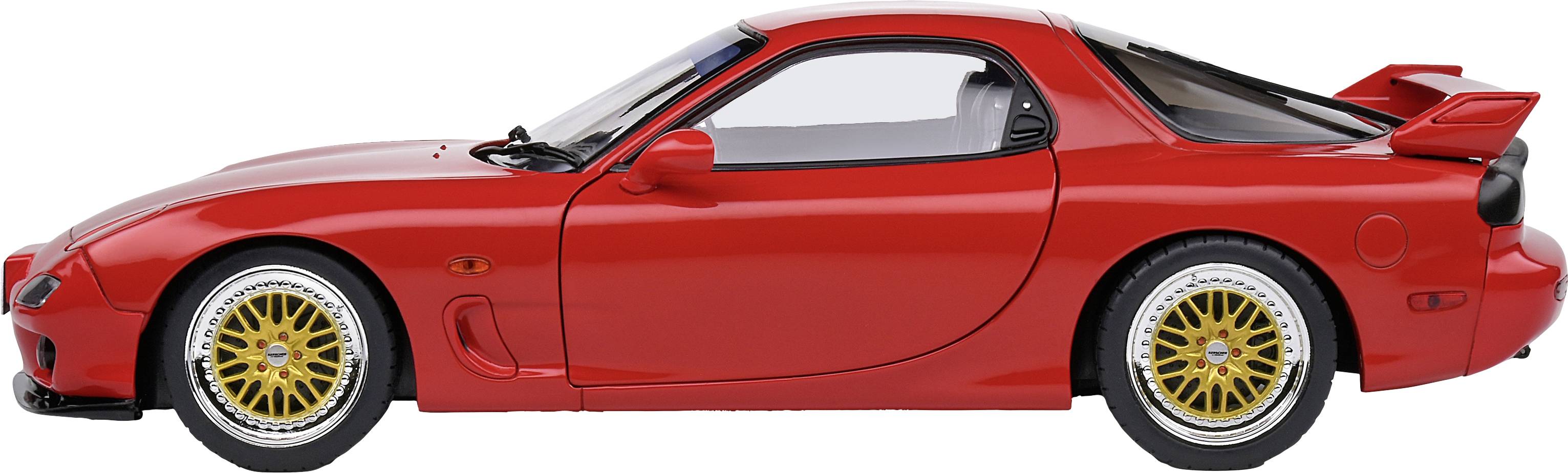 Red sports car in side view with gold wheels and spoiler.
