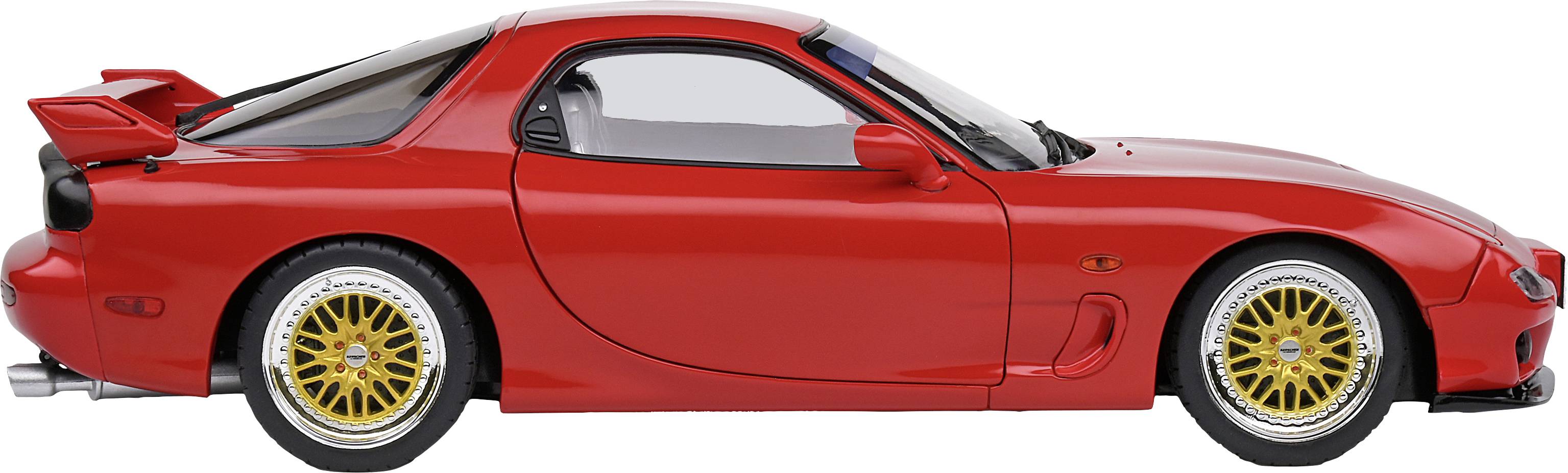 A red sports car, side view, with gold alloy wheels and a large rear spoiler.