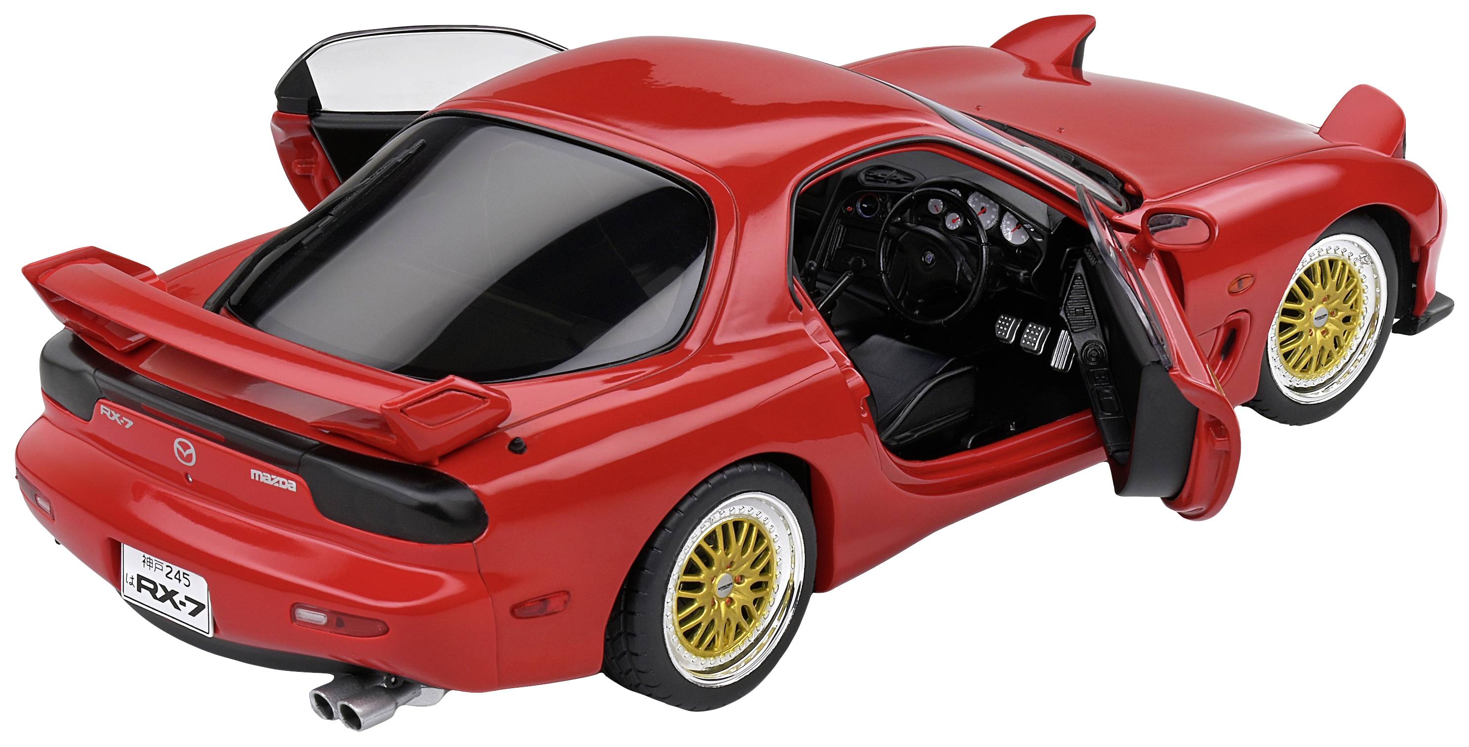 Red sports car with an open driver's door, golden alloy wheels, and visible interior. Model type is 'RX-7'.
