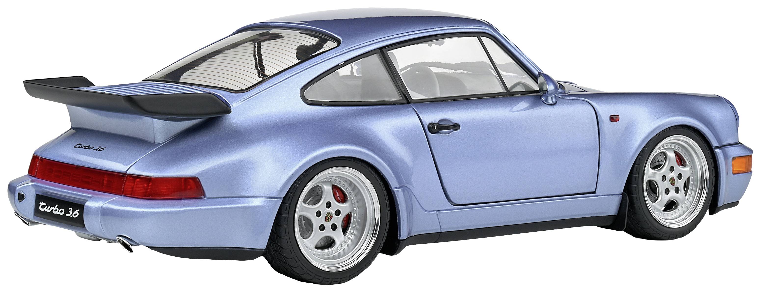 A light blue, two-seater sports car with a large rear spoiler, side view. Vehicle is parked on a flat surface.