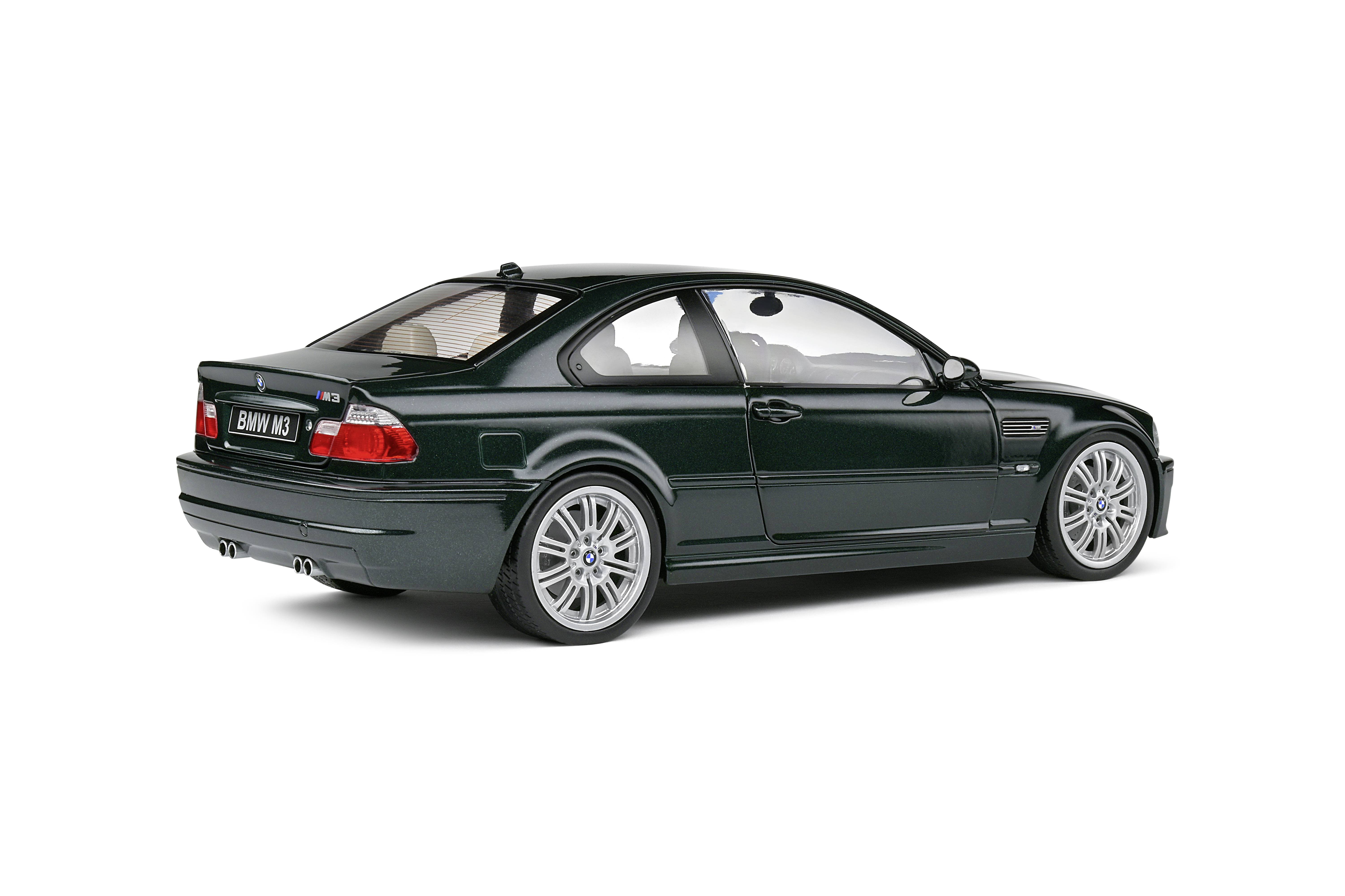 A black BMW M3 is parked sideways on a flat surface. The car has a sporty design with tinted windows.