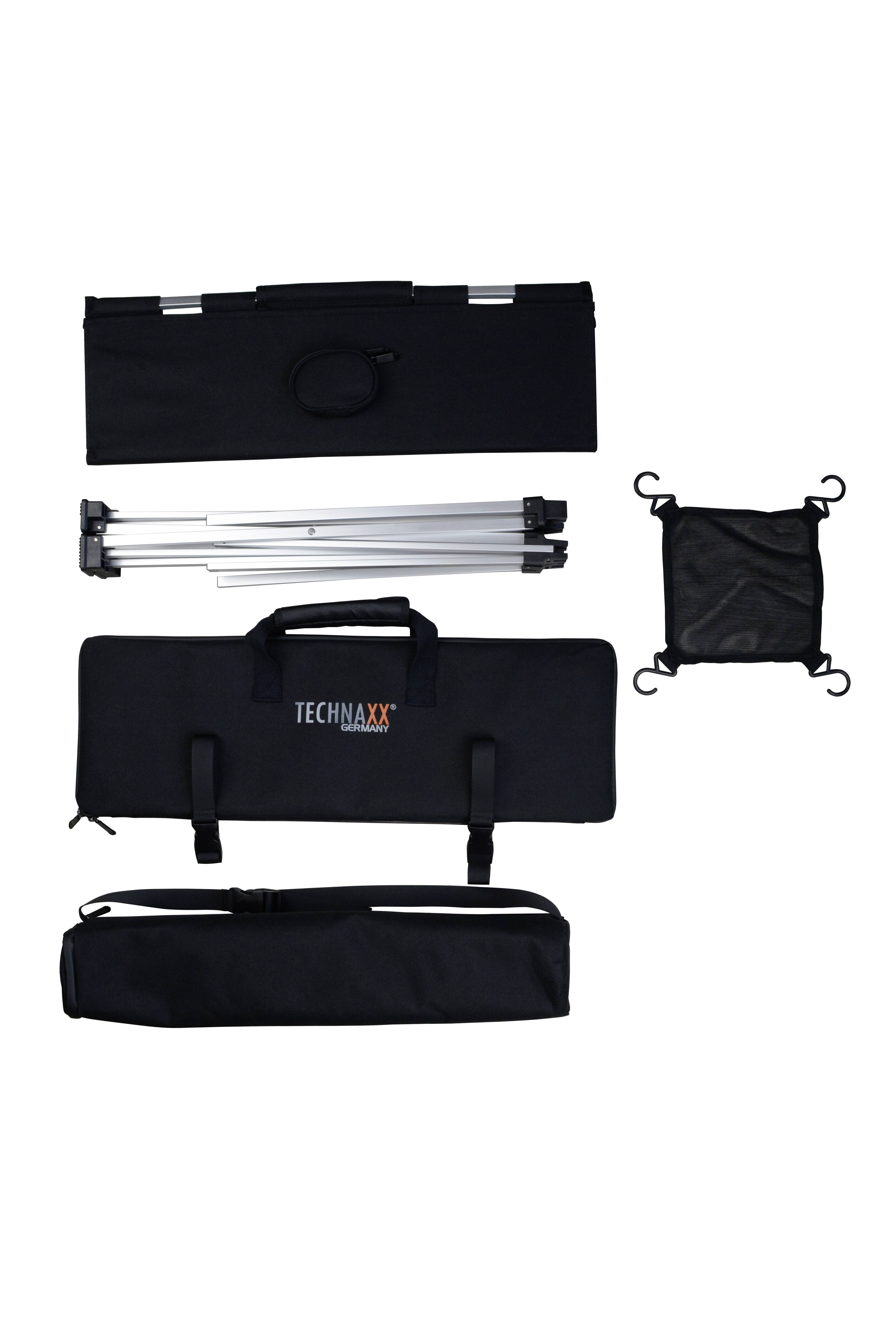 Various parts of a mobile projection table, including a black carry bag, an extendable tripod, and additional accessories.