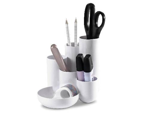 A white desk organiser containing scissors, two pencils, a pen, two markers, and tape in various compartments.