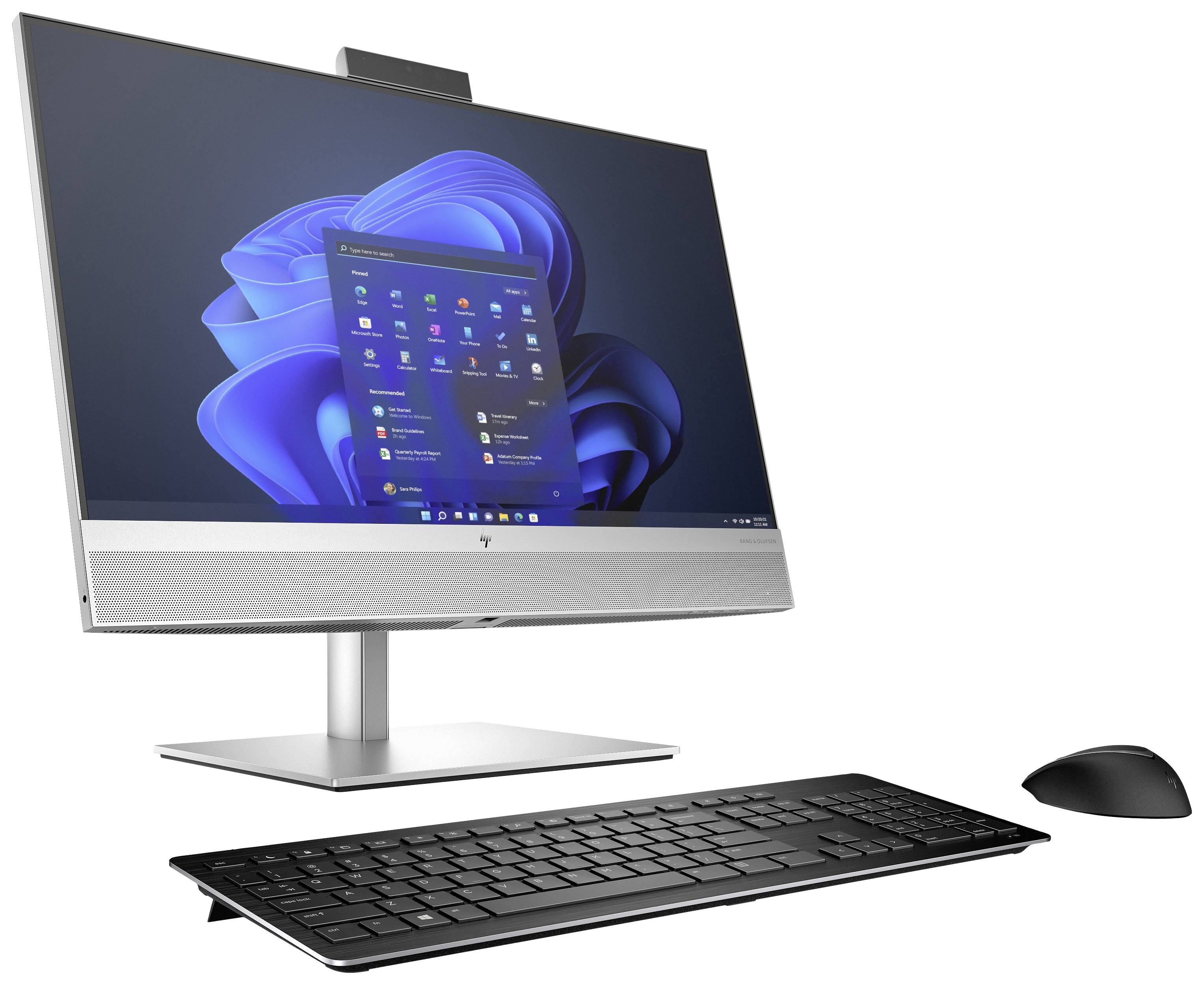 A modern desktop computer with a flat monitor, black keyboard and mouse. The screen displays an operating system with icons.