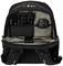 Opened black rucksack with an organised interior compartment containing a keyboard and a mouse. Ideal for tech accessories.