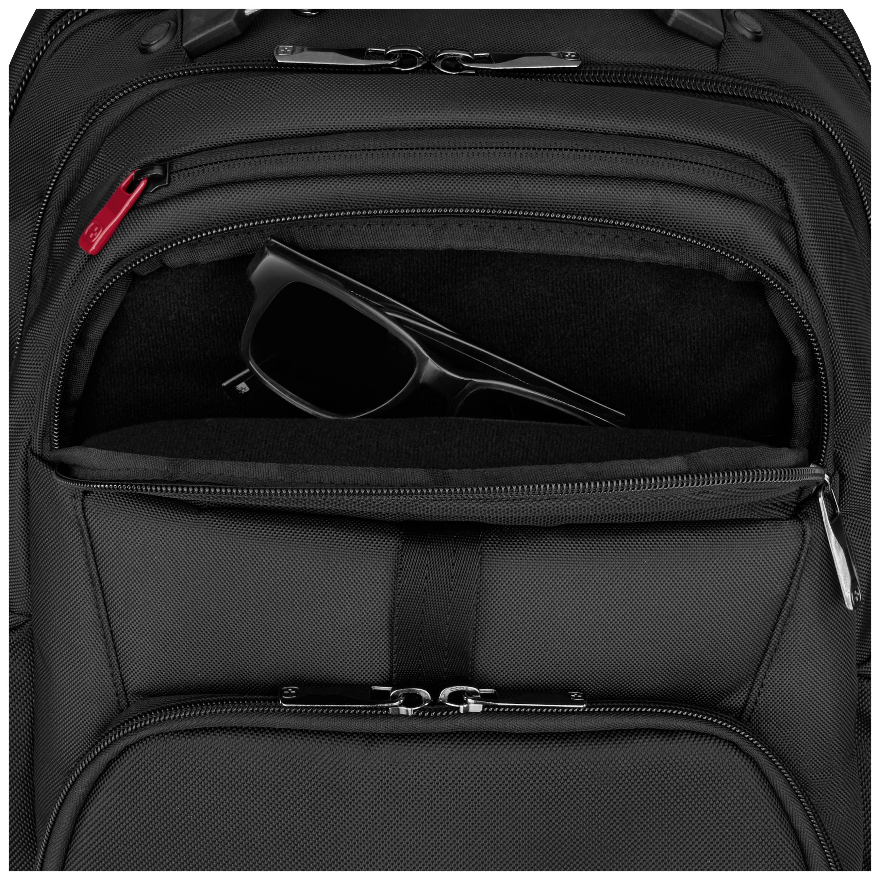 A black fabric rucksack with a partially open front pocket, storing a pair of black sunglasses.