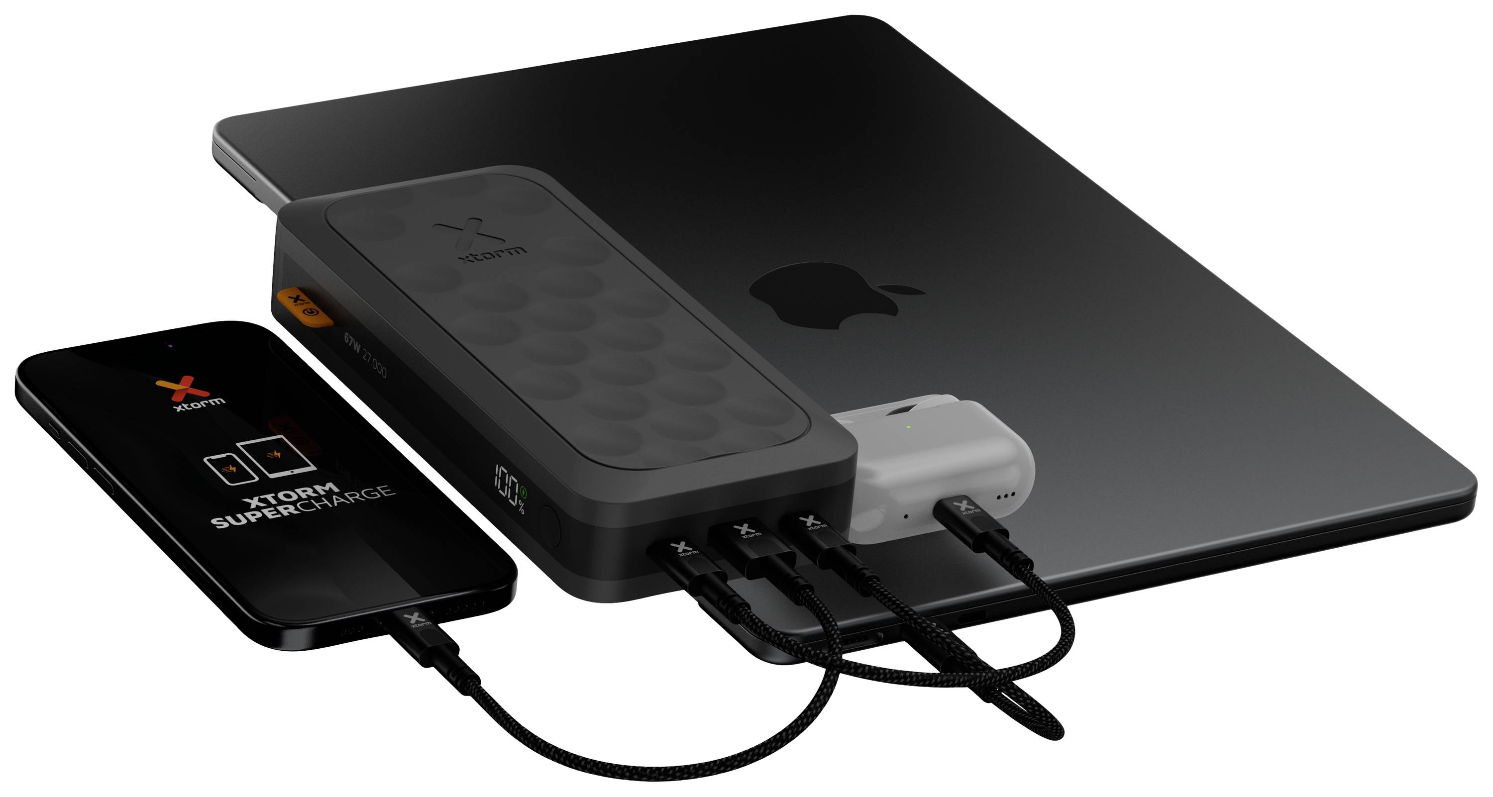 A laptop, a smartphone and a power bank are connected with charging cables. The devices display the Xstorm logo.