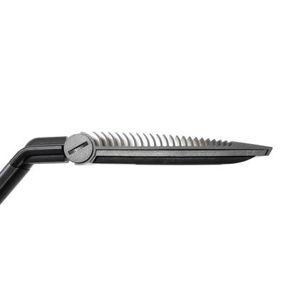Hair comb with integrated razor, shown from the side. Suitable for simultaneously combing and trimming hair.