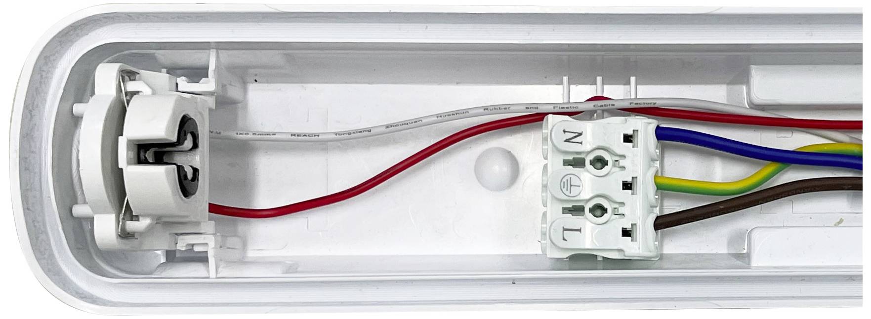 Close-up of an electrical junction box with multiple coloured wires passing through a white plastic cover.