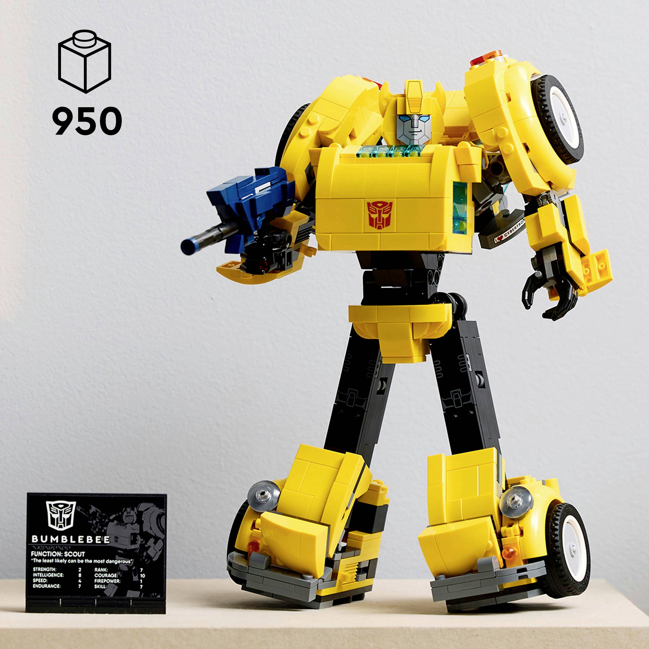 A yellow and black toy model of a robot with blue arms, transforming like a car. An information board is positioned on the left.