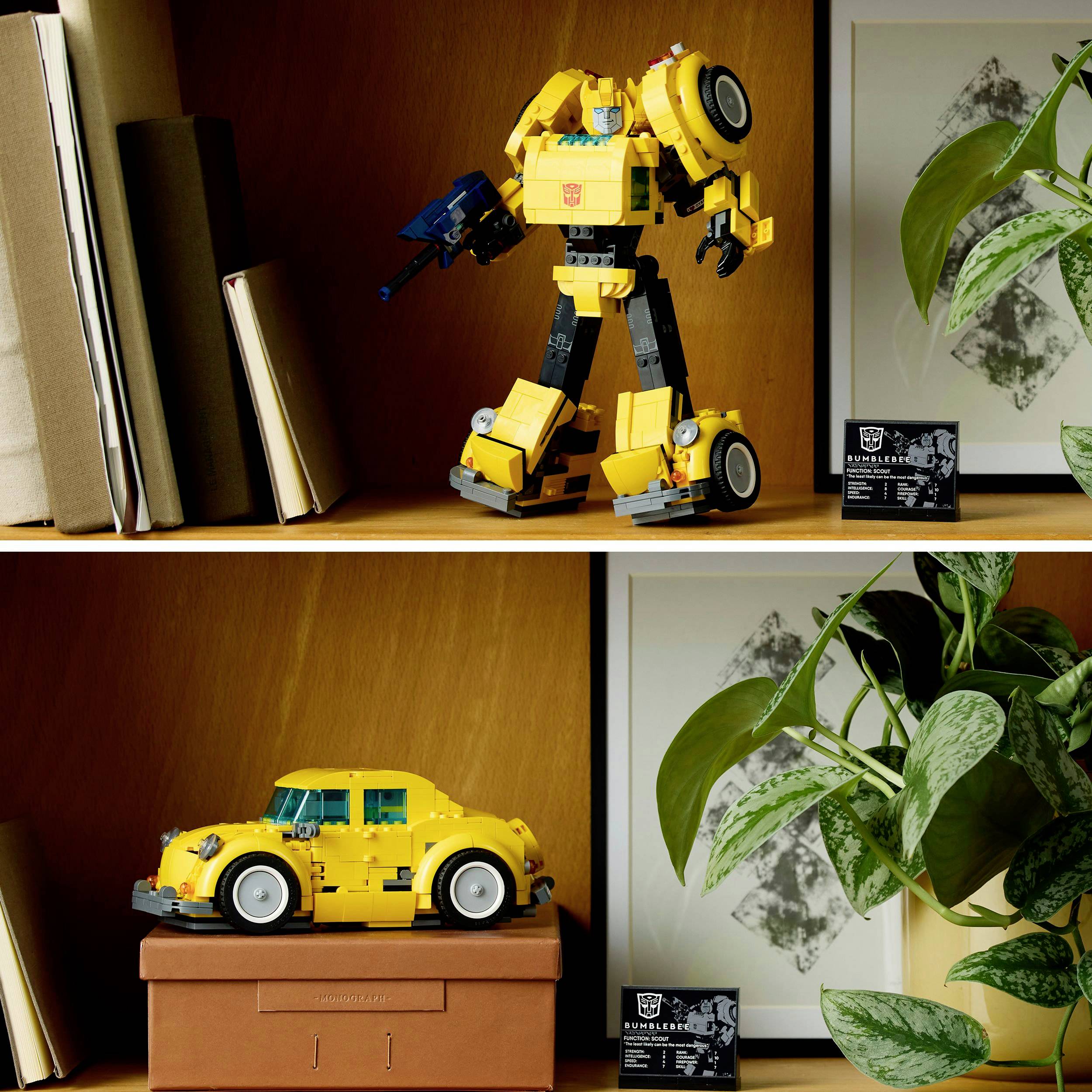 Two shelves with toy cars made from building blocks: on top, a yellow robot, below, a yellow car. Both surrounded by books and plants.