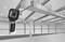 Handheld thermal camera inspects ventilation system in an industrial building. Thermal imaging for leak detection.