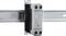 A solid-state relay (SSR) is mounted on a metal rail. It is used for controlling electrical loads without mechanical components.