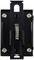 A black wall switch with a visible spiral spring in the centre and four screws at the corners for mounting.