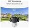 A panoramic security camera with 180° view shown in a residential neighborhood, emphasizing coverage of every corner. Text reads '180° Panorama. Sichern Sie jede Ecke ab.'