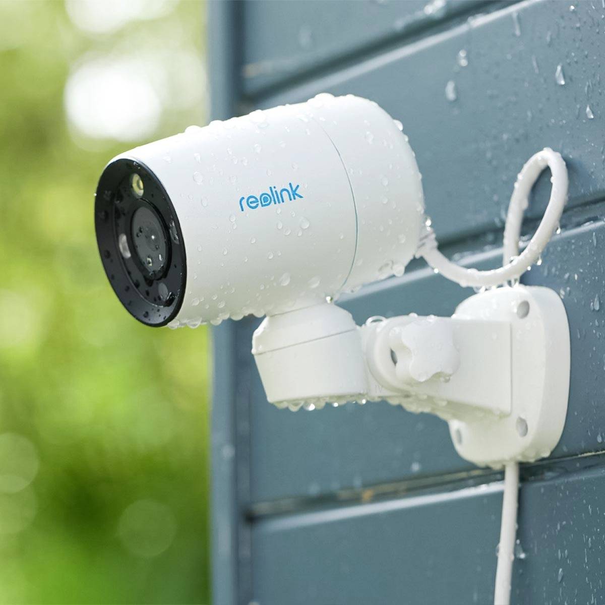 Security camera mounted on an external wall, facing left to monitor the premises.